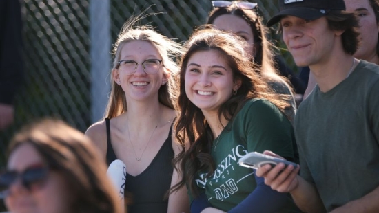 Lakers smiling on stands during NU Homecoming 2025