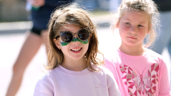 Two young girls outside during NU Homecoming 2025