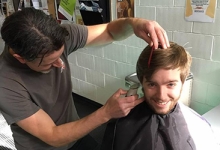 Marcus Hawco getting a haircut