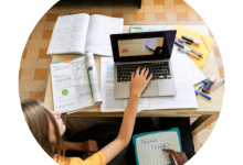 Two individuals working on developing course materials for students.