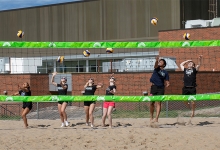 Jr. Lakers perform a ceremonial serve at the grand opening 