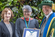 Catherine Gregory and Chancellor Russell stand with Maria Cristina Aguilera Valle, recipient of this year's Chancellor's Medal for Humanity