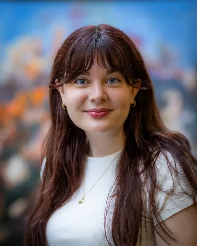 A woman in white t-shirt against the library background