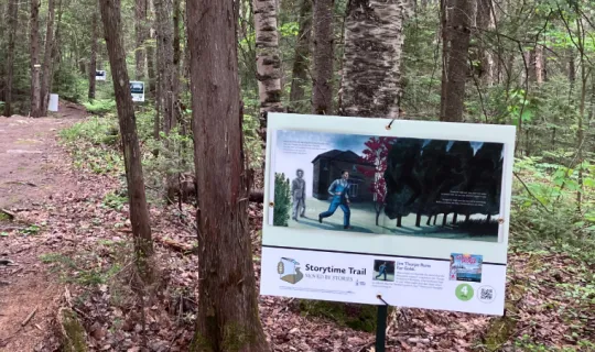 StoryWalk signs along the campus trails