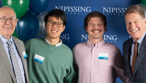 NU students pose with donor Jack Jones and Chancellor Russe;l