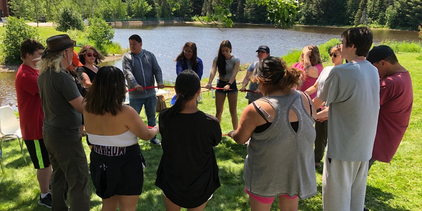Summer Indigenous Institute group by pond