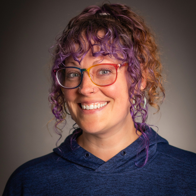 Woman in Nipissing sweater smiling