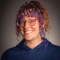 Woman in Nipissing sweater smiling