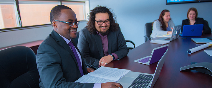Business student working with a professor